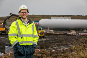 Project Manager standing in front of an energy park