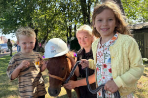 Three children and a pony