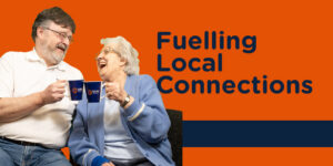 Two older people holding mugs with caption 'Fuelling Local Connections'