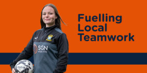 Young person wearing football training clothes holding a ball. Caption is 'Fuelling Local Teams'