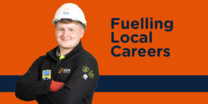 A man wearing PPE with caption 'Fuelling Local Careers'
