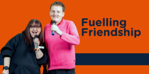 Two people singing karaoke - Caption is 'Fuelling Friendship'